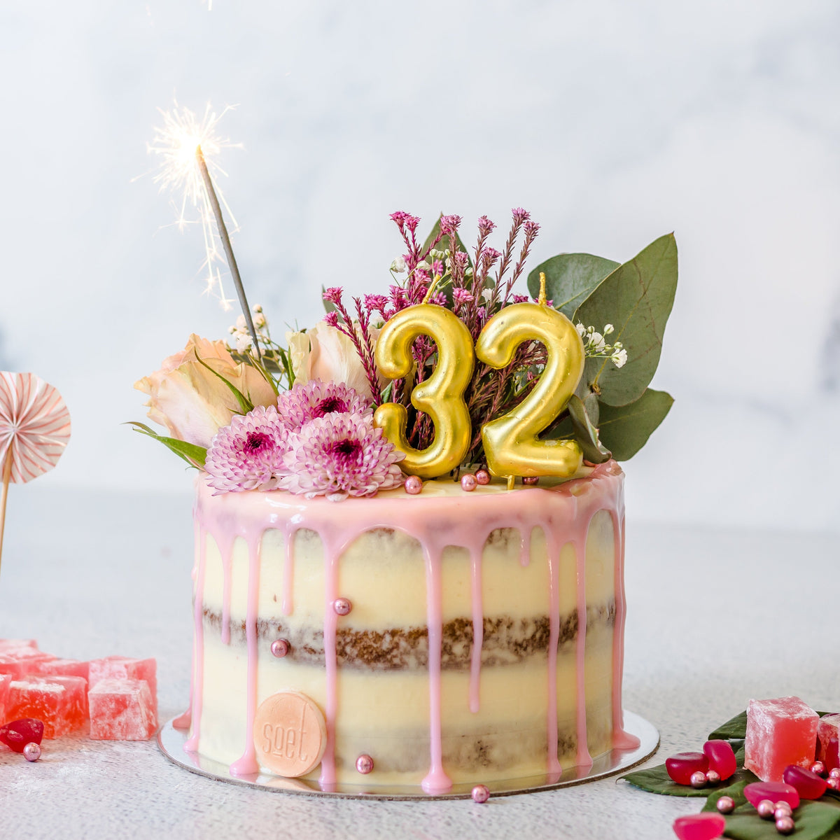 Full flower bouquet semi-naked drip cake